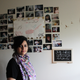 Sana in her dorm room, where she has been living since 2014. Pictures of her family can be seen behind her, along with a sign marks the date of her father’s disappearance.